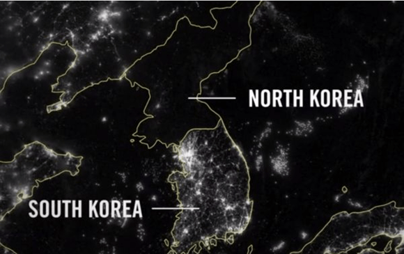 Satellite view of South and North Korea at night, illustrating the gap in development, infrastructure and the use of energy